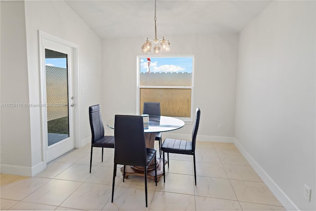 dining space with a chandelier