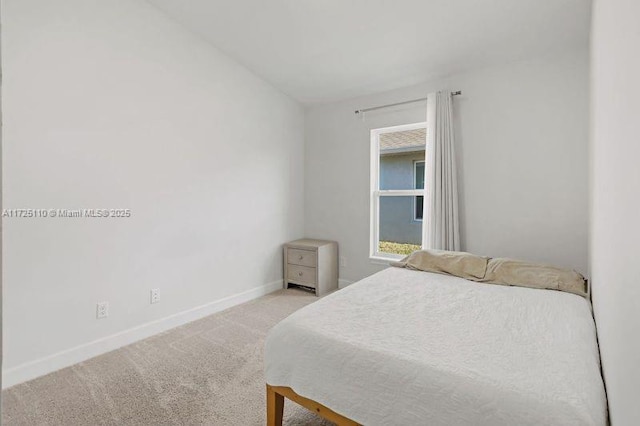 bedroom with light carpet