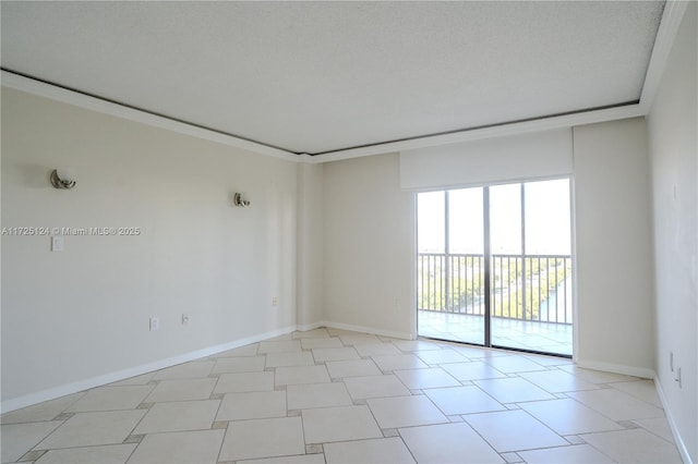 spare room with ornamental molding and a textured ceiling