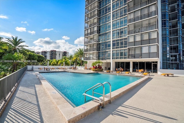 view of swimming pool featuring a patio area