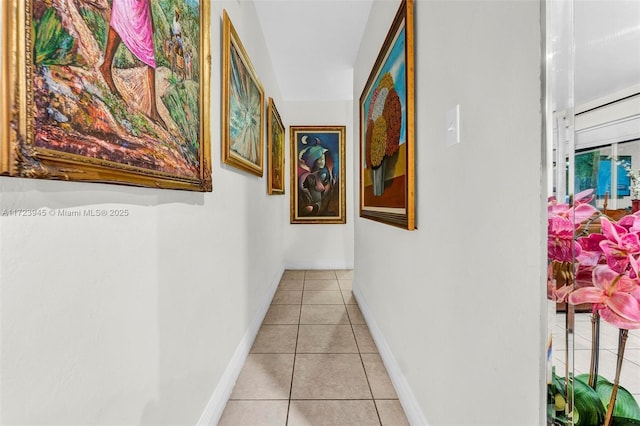 corridor featuring light tile patterned flooring