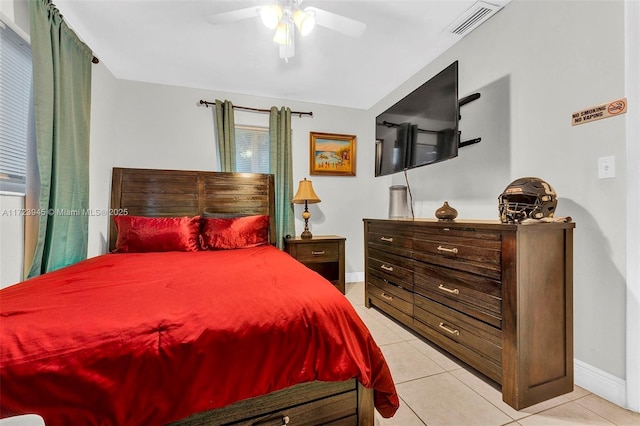 tiled bedroom with ceiling fan