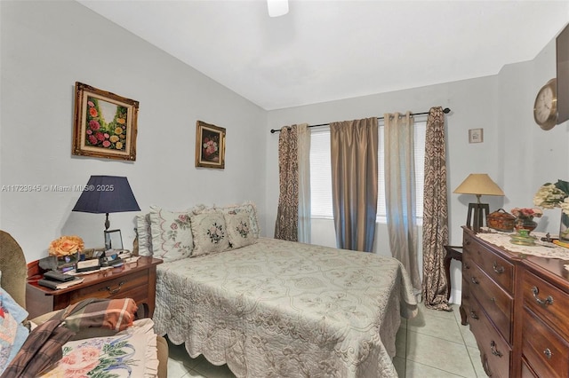 tiled bedroom with ceiling fan