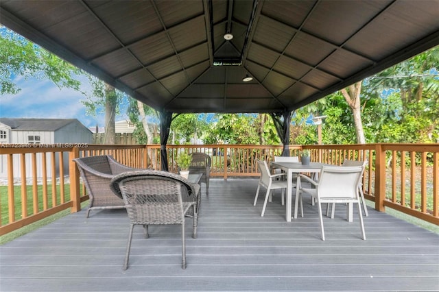 wooden deck featuring a gazebo