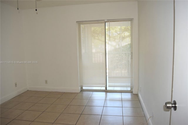 view of tiled spare room