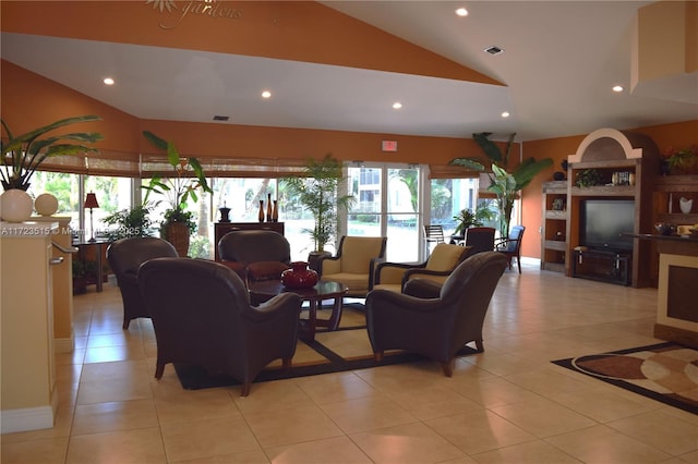 living room featuring light tile patterned flooring and vaulted ceiling