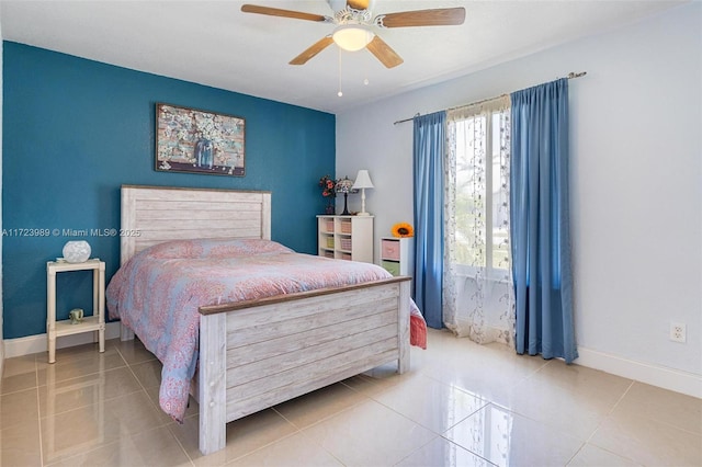 tiled bedroom featuring ceiling fan