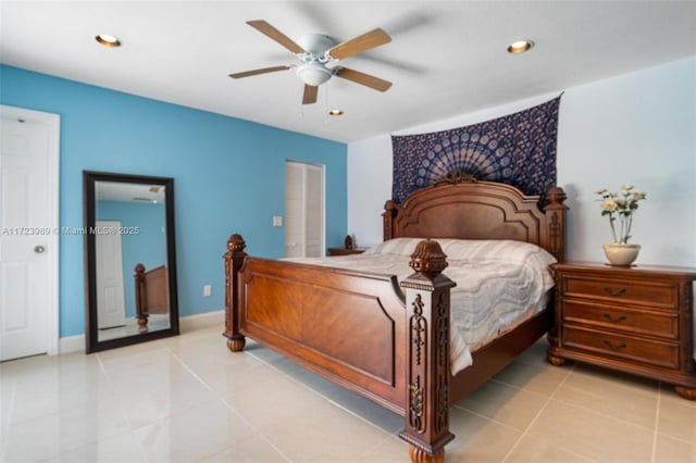 tiled bedroom featuring ceiling fan