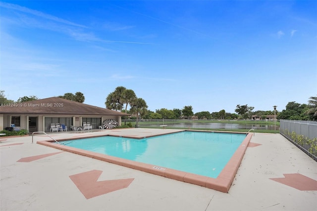 view of swimming pool with a patio area