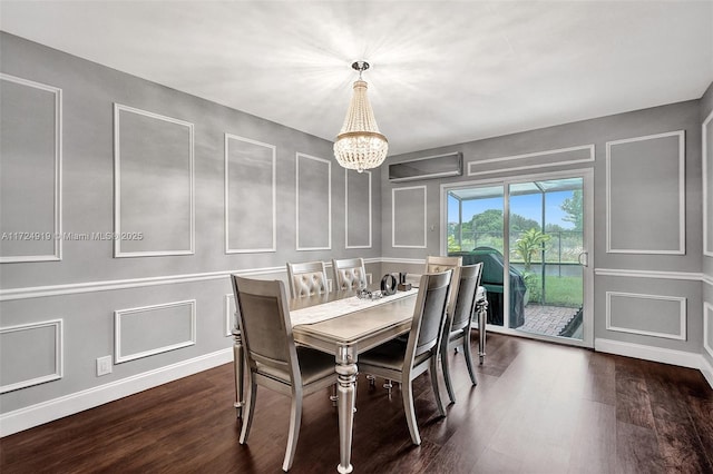 dining space featuring a chandelier and dark wood-type flooring