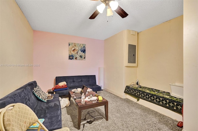 living room featuring carpet, ceiling fan, a textured ceiling, and electric panel