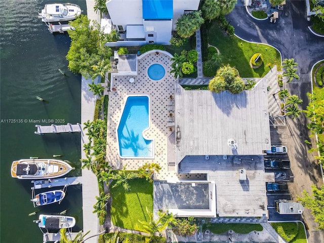 birds eye view of property featuring a water view