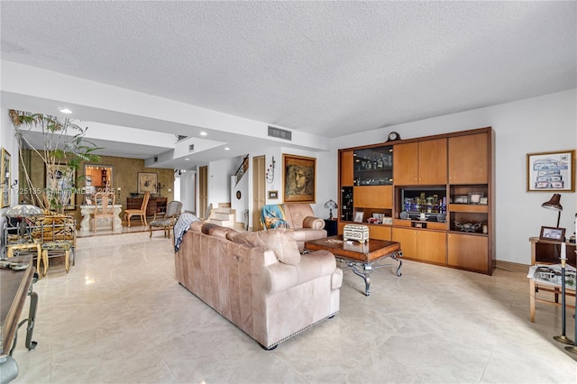 living room with a textured ceiling