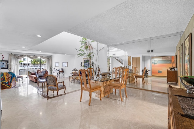 dining area featuring a textured ceiling