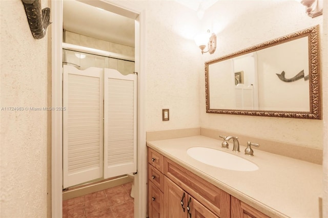 bathroom with tile patterned flooring and vanity