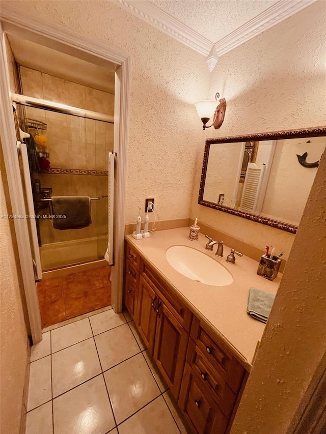 bathroom featuring a textured ceiling, tile patterned flooring, crown molding, enclosed tub / shower combo, and vanity