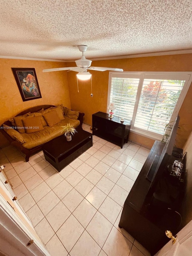 tiled living room with a textured ceiling and ceiling fan