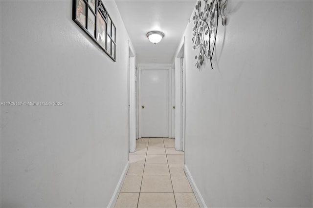 hallway with light tile patterned floors