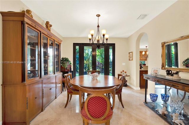 dining area featuring a chandelier