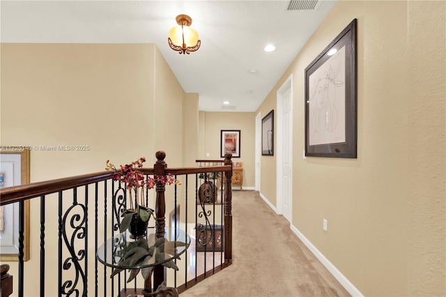 corridor with light colored carpet