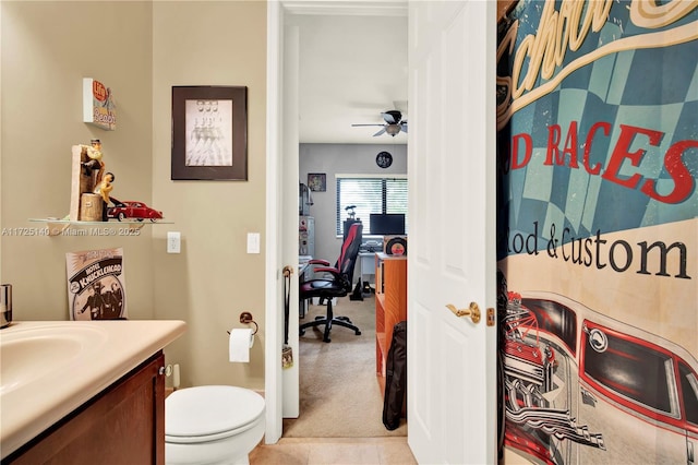 bathroom with vanity, ceiling fan, and toilet