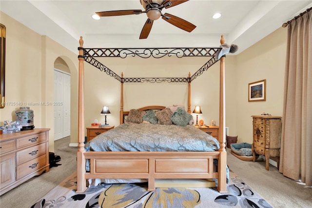 bedroom with light colored carpet and ceiling fan