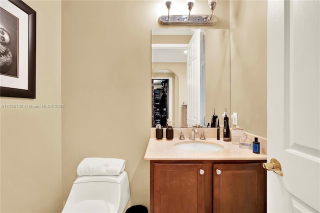 bathroom with vanity and toilet