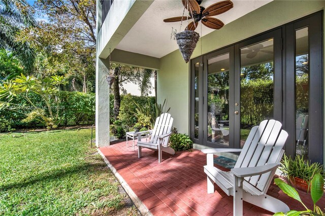 view of patio featuring french doors and ceiling fan