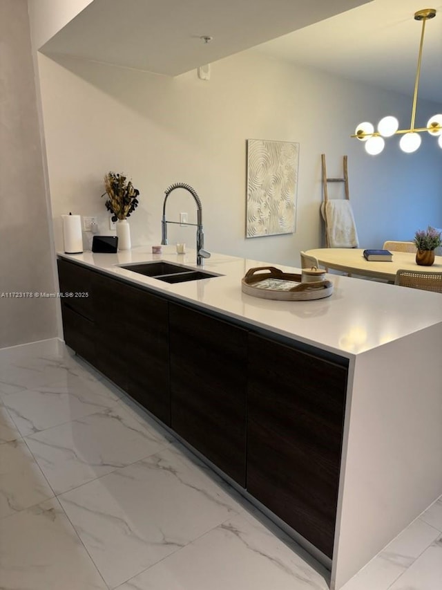 kitchen with sink and decorative light fixtures