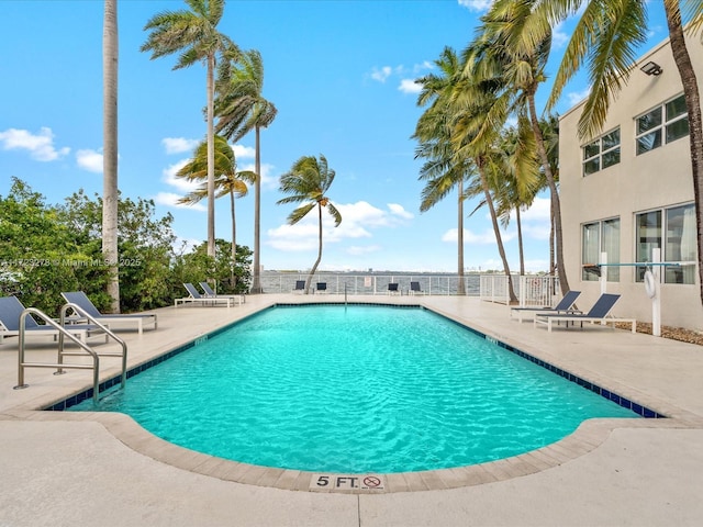 view of swimming pool with a patio