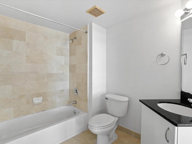 full bathroom with toilet, vanity, tiled shower / bath, and tile patterned flooring