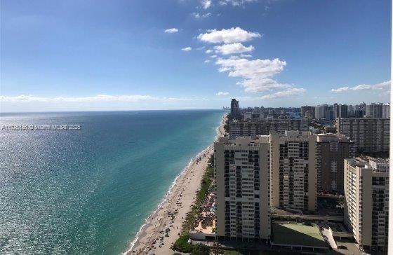 aerial view featuring a beach view and a water view