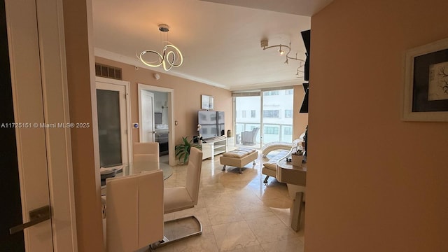 interior space featuring a notable chandelier, crown molding, visible vents, and tile patterned floors