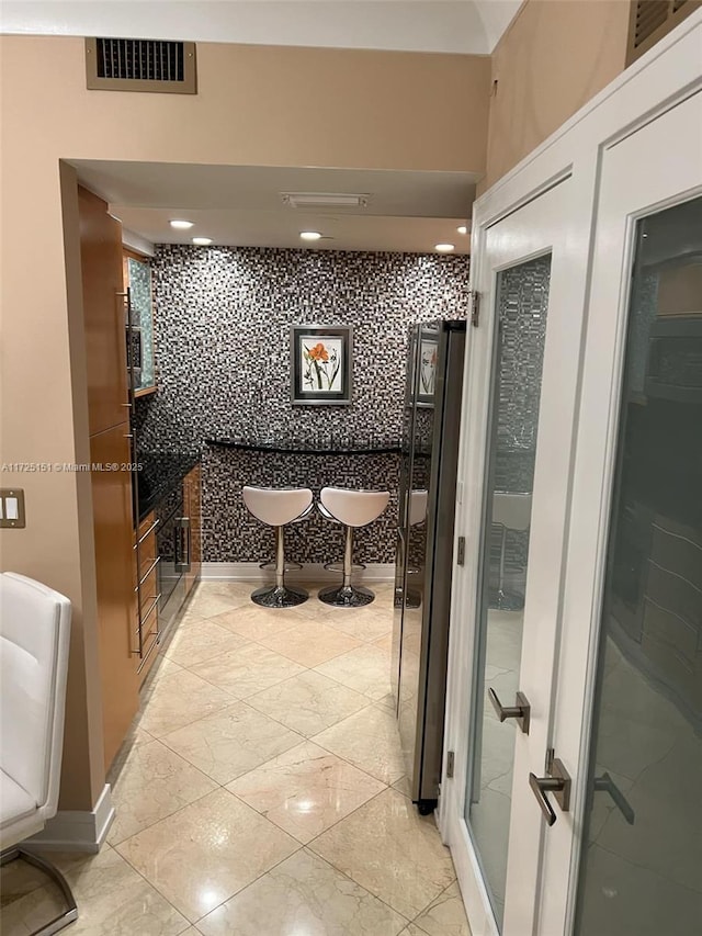 bathroom with tile walls