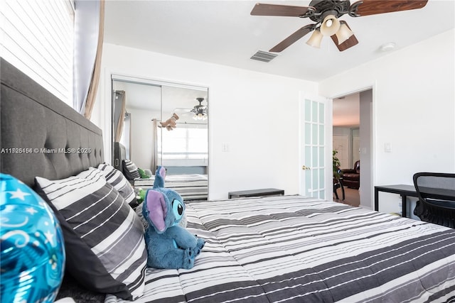 bedroom featuring ceiling fan and a closet