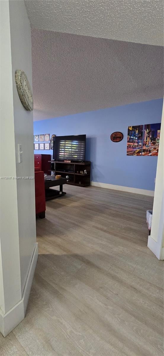 hall with hardwood / wood-style flooring