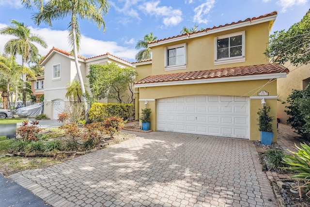 mediterranean / spanish-style house featuring a garage