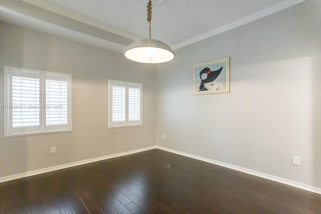 unfurnished room featuring dark wood-type flooring and ornamental molding