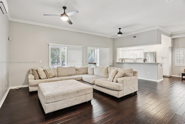 living room featuring ornamental molding, a wall mounted AC, ceiling fan, and dark hardwood / wood-style floors