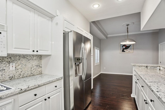 kitchen featuring stainless steel refrigerator with ice dispenser, dark hardwood / wood-style flooring, white cabinets, and pendant lighting