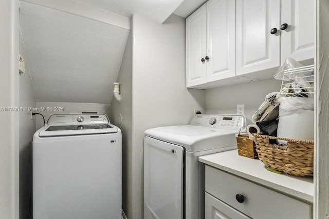 laundry area with cabinets and independent washer and dryer