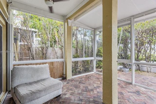 sunroom / solarium with ceiling fan and a wealth of natural light