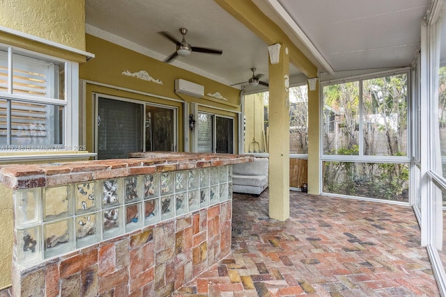 sunroom / solarium featuring an AC wall unit and ceiling fan