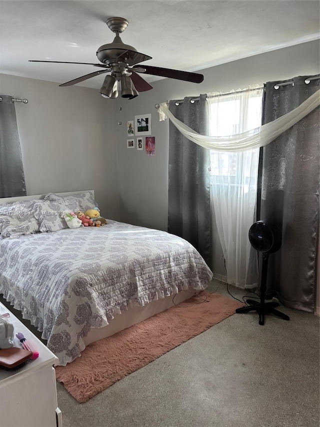 bedroom with ceiling fan and carpet flooring