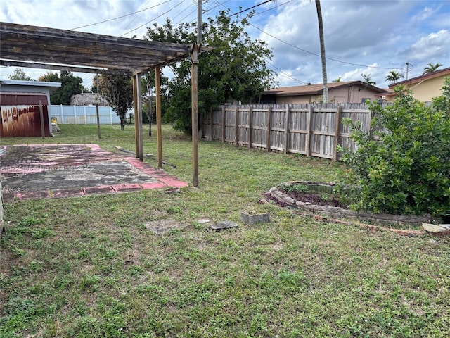 view of yard with a pergola and a patio