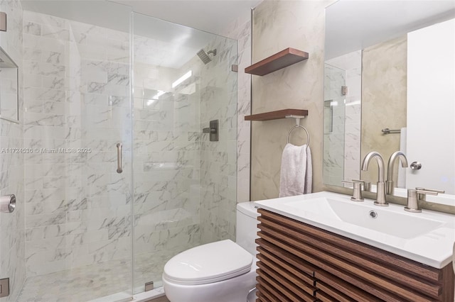 full bathroom featuring a shower stall, vanity, and toilet
