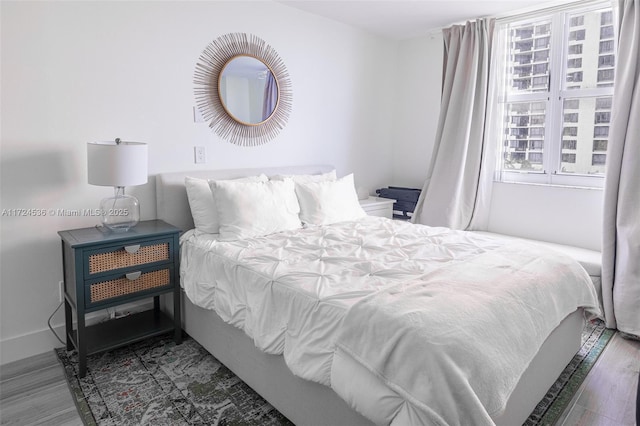 bedroom featuring wood-type flooring