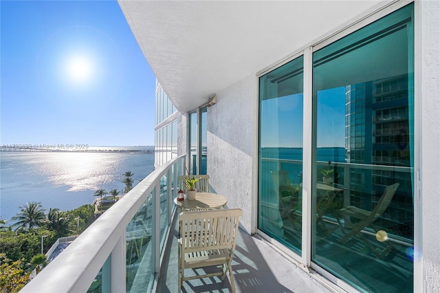 balcony featuring a water view