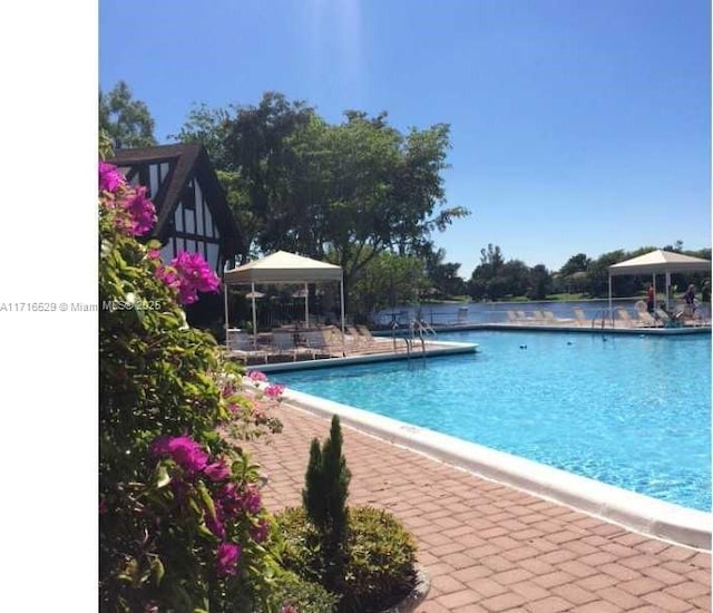 view of pool featuring a gazebo and a patio