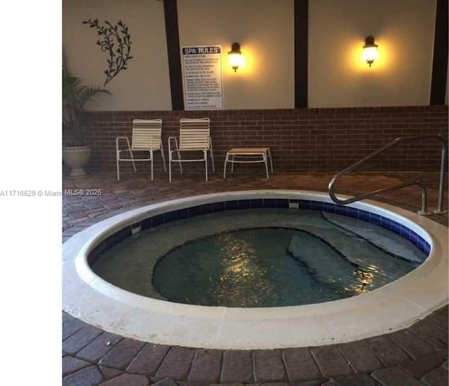 view of pool featuring a community hot tub